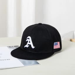 Hip-hop style baseball cap with a flat top, color patching, letter embroidery. Suitable for both women and men
