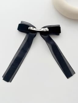 A piece of elegant velvet netting hair accessory featuring double bow hairpins for ladies, suitable for formal events.
