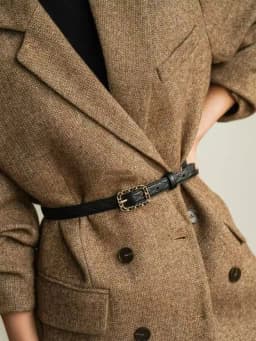 A Versatile and Fashionable Winter Outfit for Women, Featuring a Quilted, Stylish, and Minimalist Design with Decorative Element