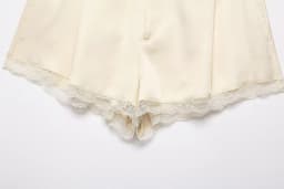 European and American style spring new women's casual style front pleated mid waist lace embellished satin texture shorts