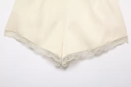 European and American style spring new women's casual style front pleated mid waist lace embellished satin texture shorts