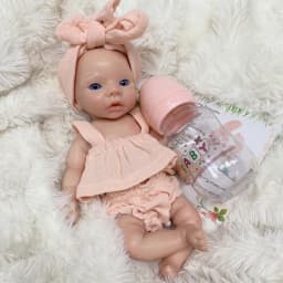 10 Inch Meadow Full Body Silicone Reborn Doll With Pink Outfit Lifelike Newborn Hand‑Painted Waterproof Collectible Art Ornament for Holiday & Birthday Gifts