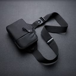 A stylish men's mini crossbody bag, crafted from nylon fabric, featuring a honeycomb-patterned back panel designed to hold a mob