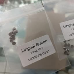 100Pcs Dental Lingual Button Orthodontic Bondable Metal Round Mesh Tongue Side Buckle Round Base