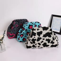 Trendy Cow Print Dot Handbag with High-End Color-Blocking Knitted Clip-On Design, Spacious and Versatile Fashion Tote.