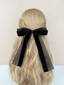 A piece of elegant velvet netting hair accessory featuring double bow hairpins for ladies, suitable for formal events.