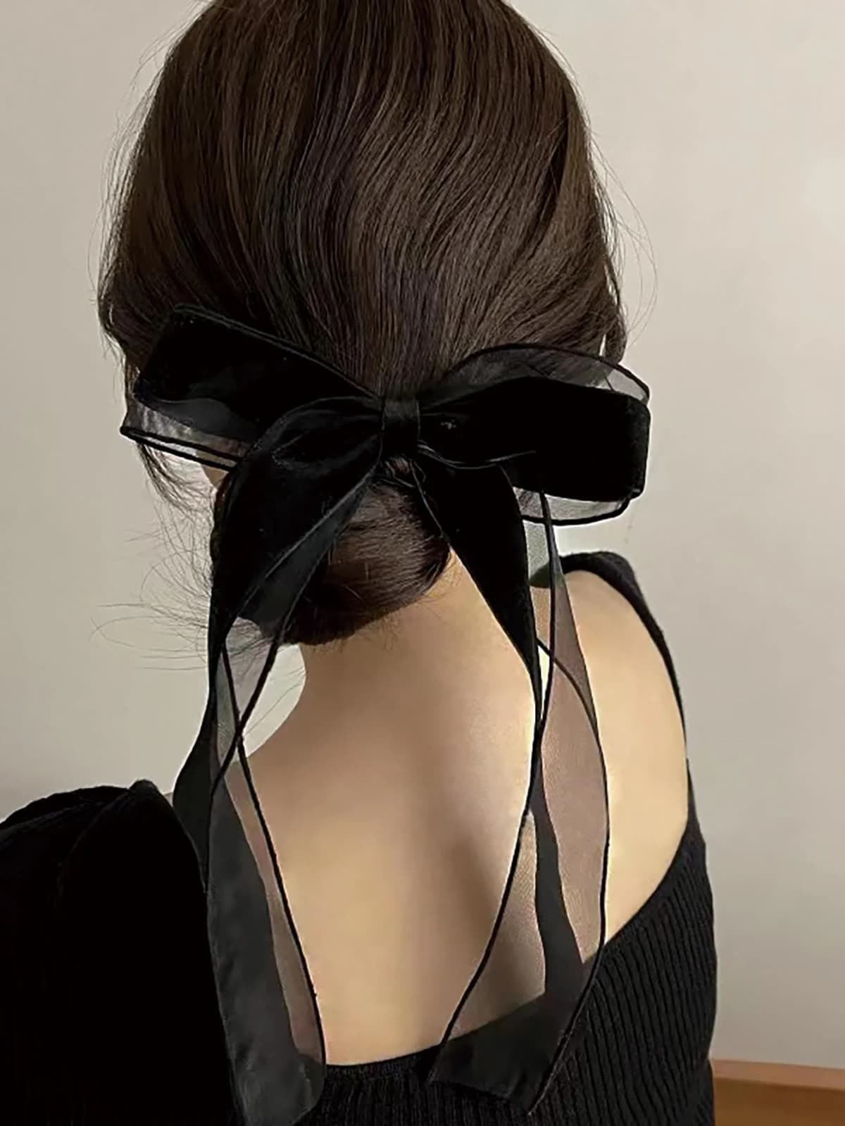 A piece of elegant velvet netting hair accessory featuring double bow hairpins for ladies, suitable for formal events.